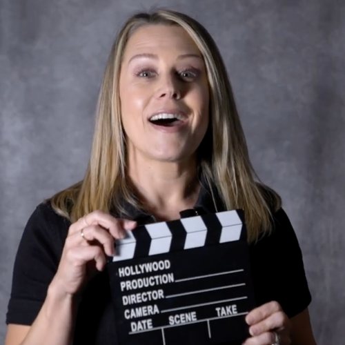 Anne Clare Lush holding a film clapperboard