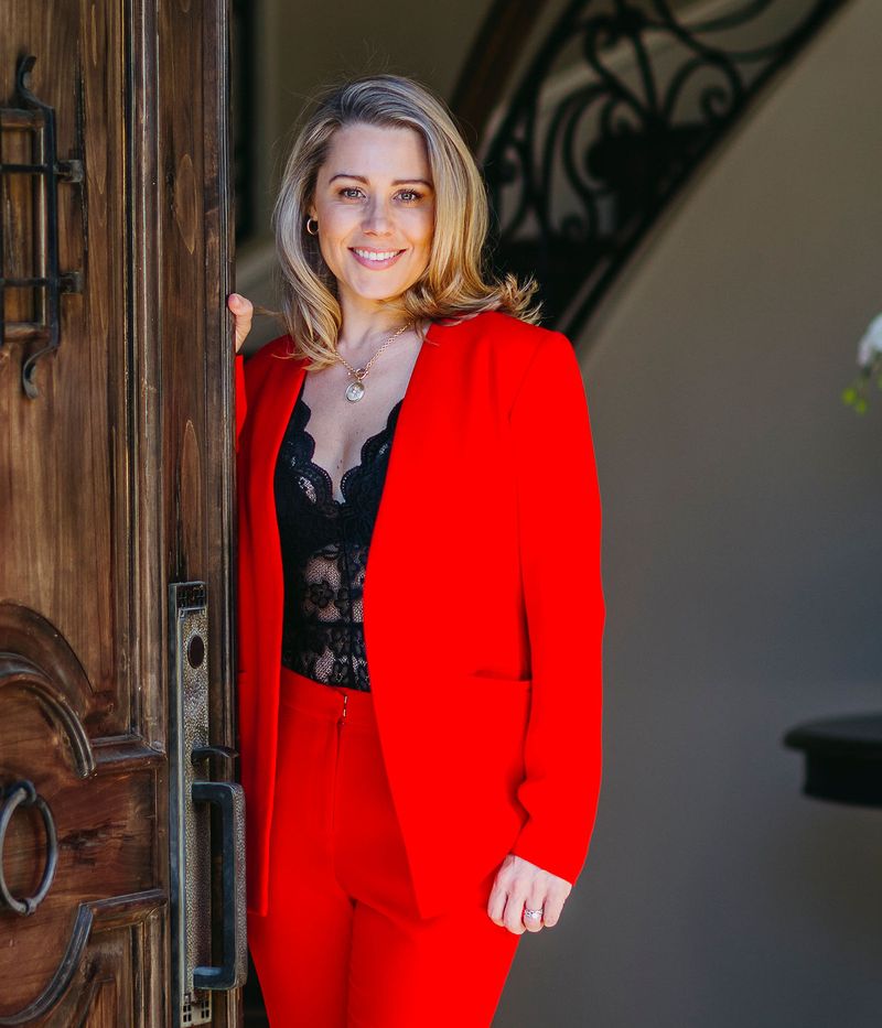 Anne Clare Lush standing in the doorway of a home