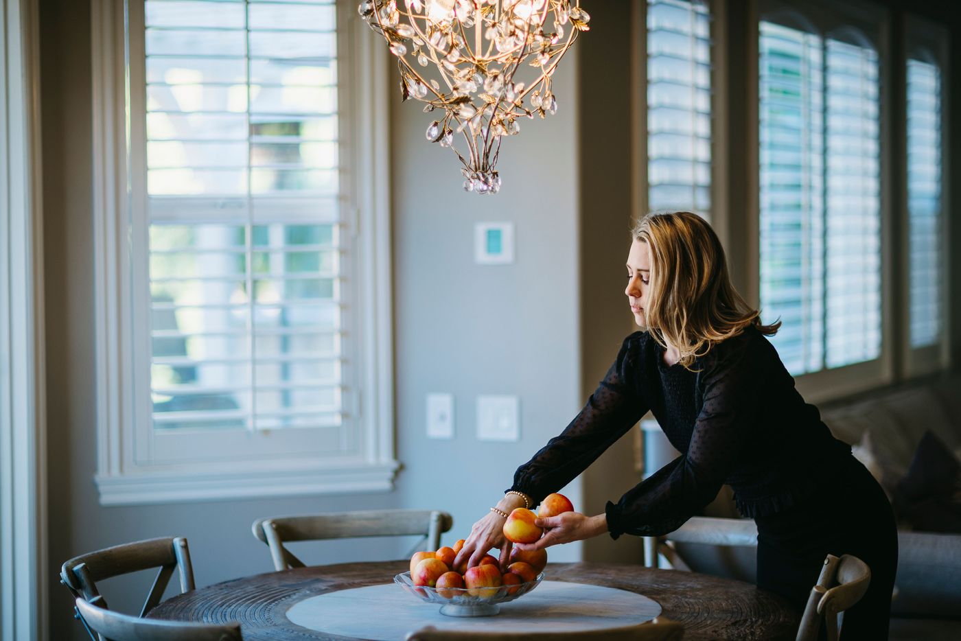 Anne Clare Lush preparing a dining room for a home sale